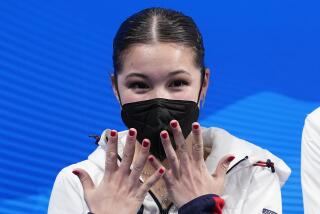 FILE - Alysa Liu, of the United States, reacts after competing in the women's free skate program during the figure skating competition at the Winter Olympics on Feb. 17, 2022, in Beijing. U.S. Olympic figure skater Alysa Liu and her father Arthur Liu – a former political refugee – were among those targeted in a spying operation that the Justice Department alleges was ordered by the Chinese government, the elder Liu said late Wednesday, March 16. (AP Photo/David J. Phillip, File)