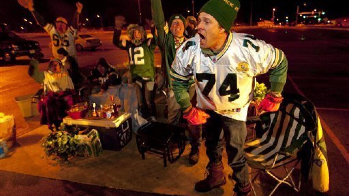 Cheesehead fans of the Green Bay Packers football team come out in droves  with their head gear and bratwursts to support the team in Green Bay,  Wisconsin - digital file from original