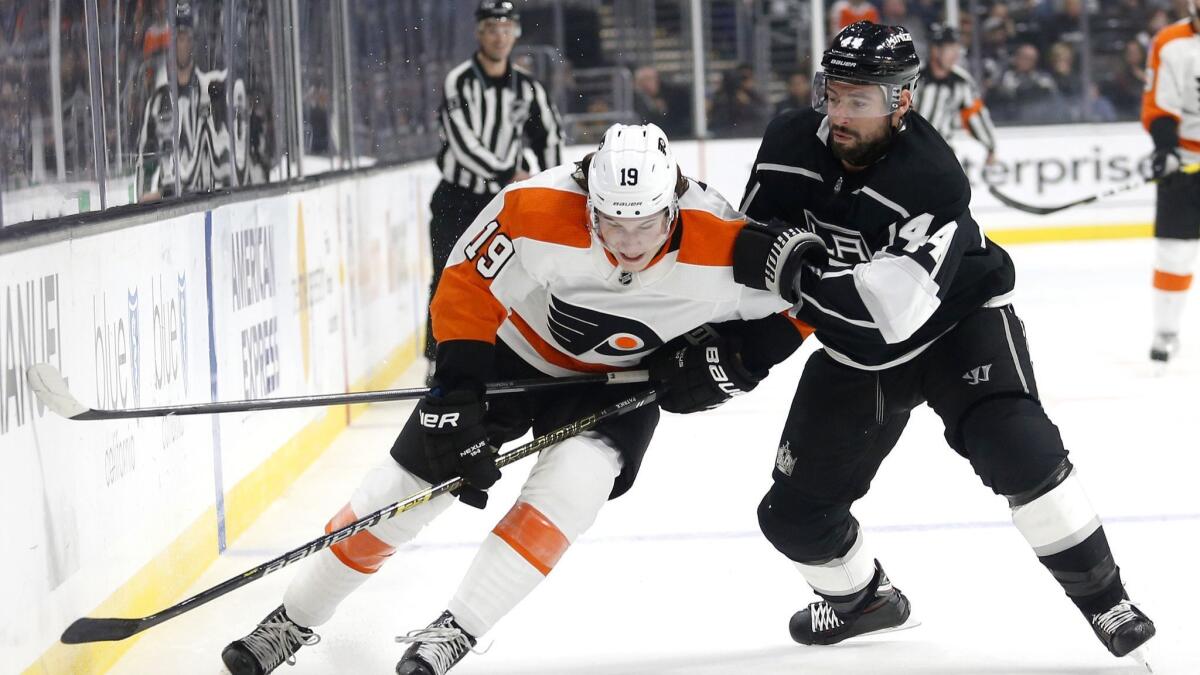 Philadelphia Flyers forward Nolan Patrick and Kings forward Nate Thompson vie for the puck during the first period of a Nov. 1 game at Staples Center.