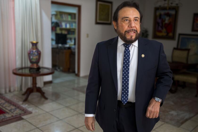 El Salvador Vice President Félix Ulloa, who is running for re-election as the running mate of President Nayib Bukele, arrives for an interview at his office in San Salvador, El Salvador, Tuesday, Jan. 30, 2024. El Salvador will hold its presidential election on Feb. 4. (AP Photo/Moises Castillo)