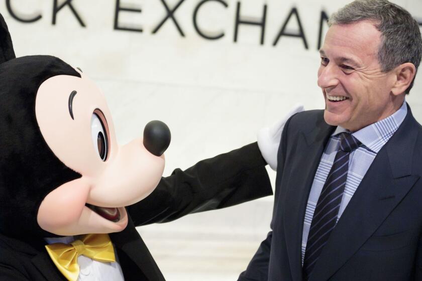 Mandatory Credit: Photo by JUSTIN LANE/EPA-EFE/REX/Shutterstock (9243928d) Bob Iger (R), the CEO of The Walt Disney Company, and company mascot Mickey Mouse stand together before ringing the opening bell of the New York Stock Exchange in New York, New York, USA, on 27 November 2017. New York Stock Exchange Disney CEO Iger, USA - 27 Nov 2017 ** Usable by LA, CT and MoD ONLY **