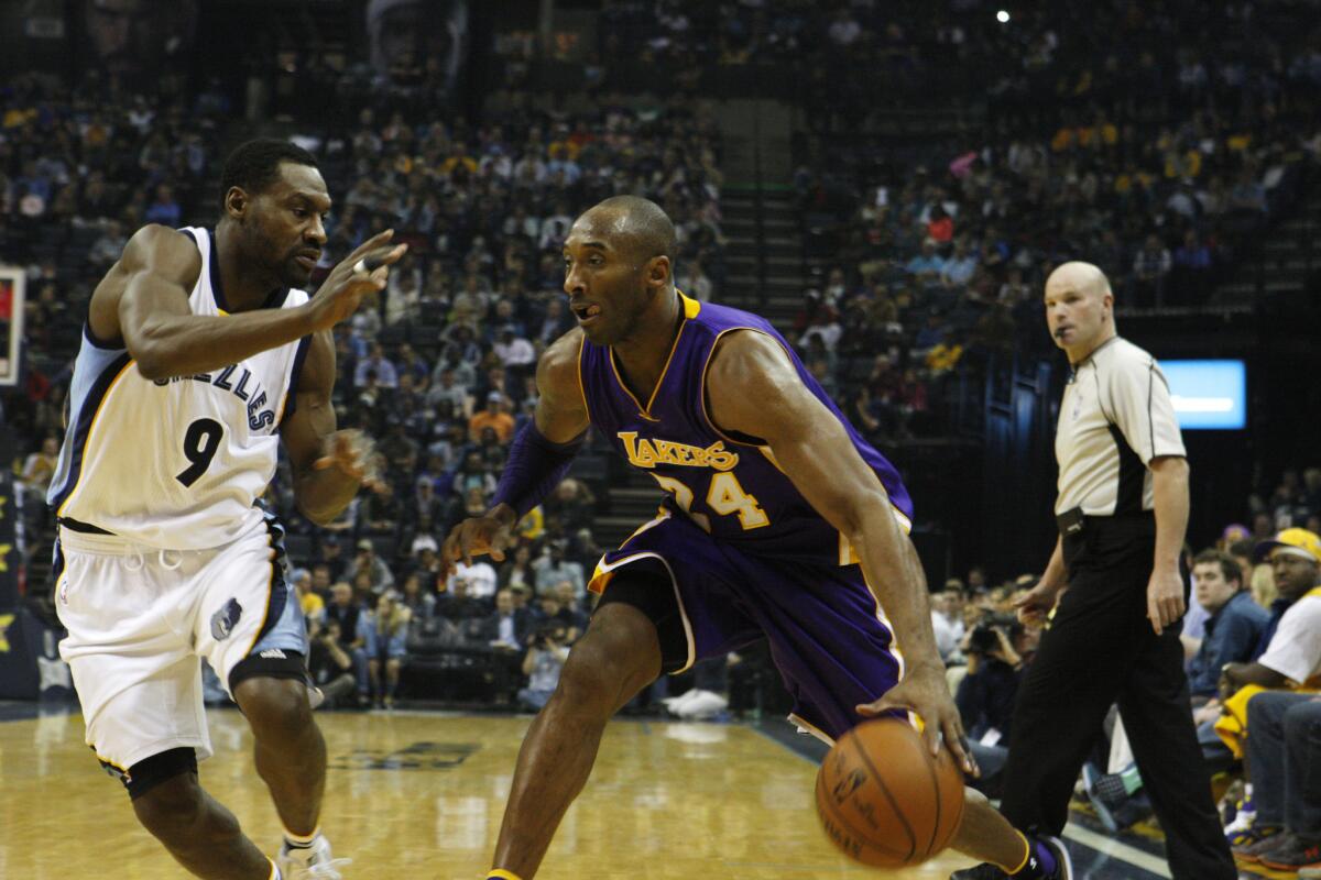 Lakers guard Kobe Bryant drives against Grizzlies guard Tony Allen in the first half Sunday.
