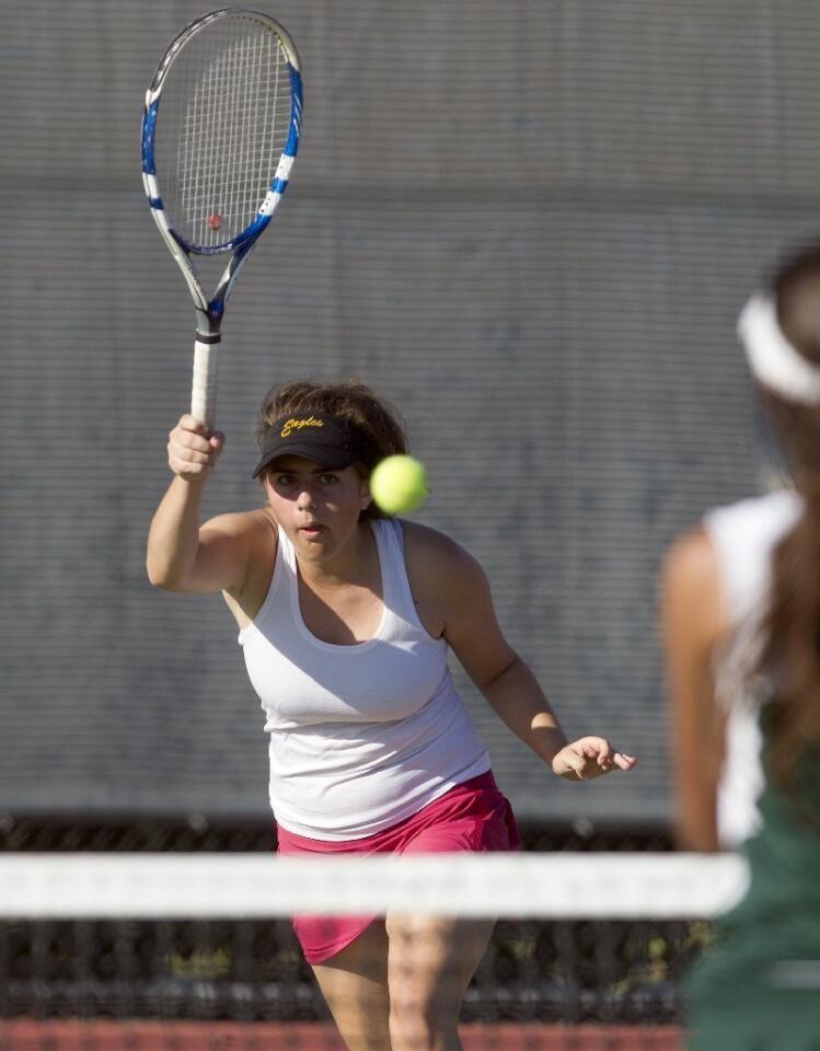 Estancia High's Julie Makley competes during a No. 1 doubles set against Costa Mesa.
