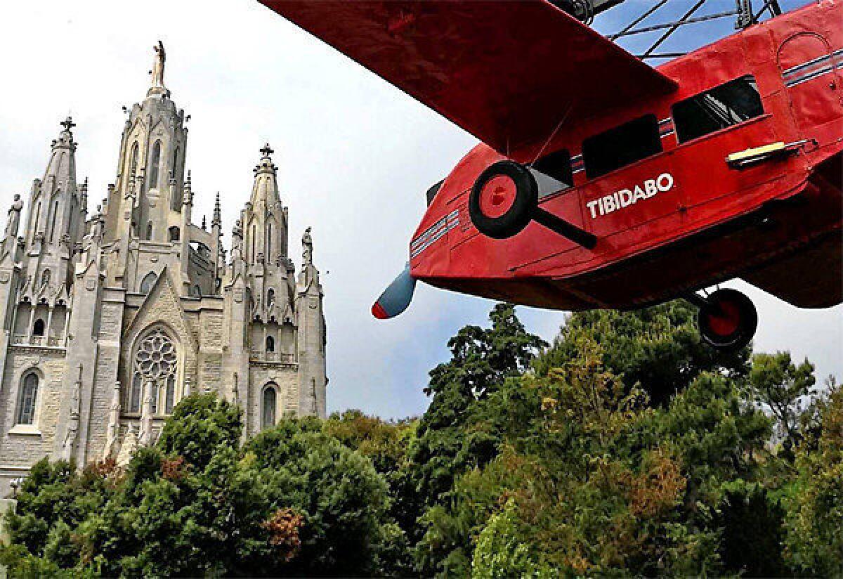 Tibidabo amusement park with the Church of the Sacred Heart beyond.