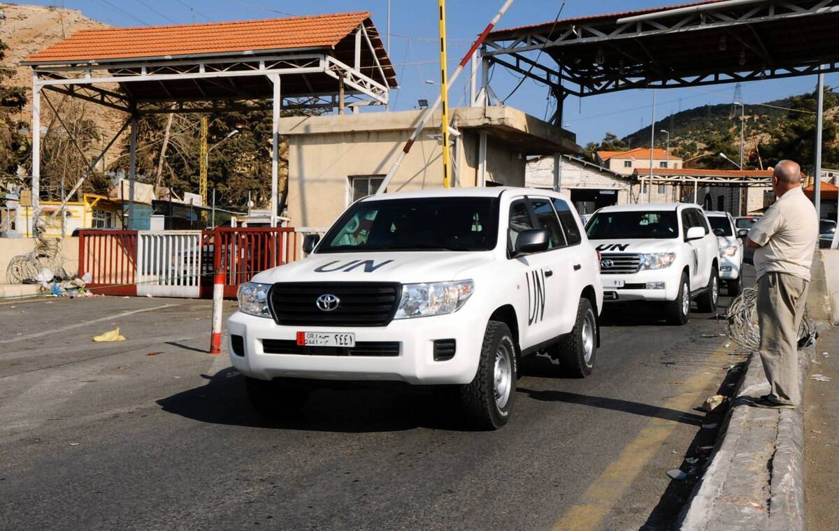 A convoy of United Nations vehicles carrying a team of experts charged with overseeing the destruction of Syria's chemical weapons travels through Beirut before leaving for Damascus.