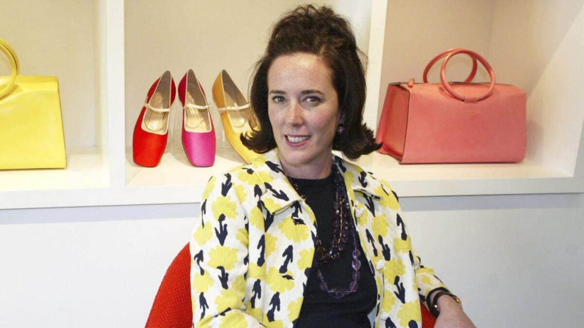 In this file photo, designer Kate Spade sits during an interview in New York. Spade is being buried in Kansas City, Mo., where she was born.