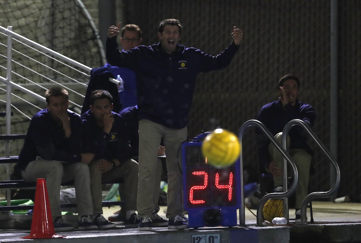 Newport Harbor coach Ross Sinclair instructs his players as they defend against Oaks Christian in the first round of the CIF Southern Section Division 1 playoffs on Thursday.