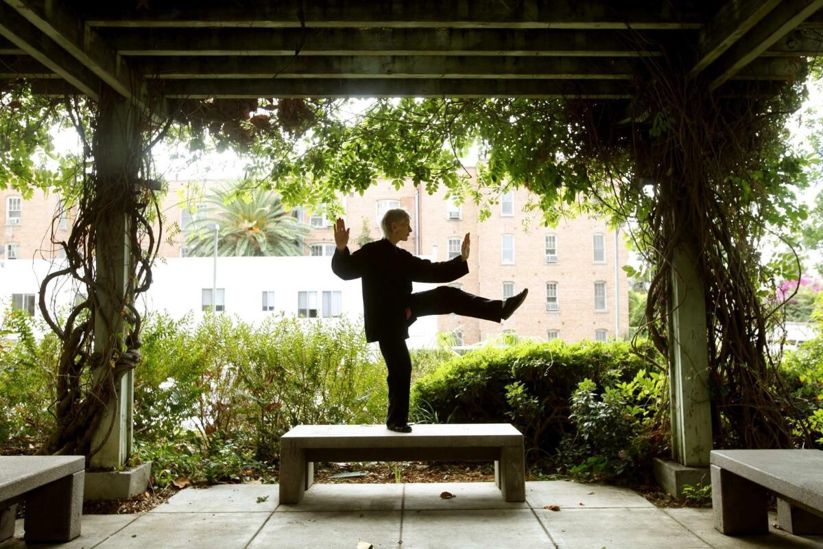 Kay D'Arcy practices Tai Chi in the garden of her Hollywood apartment Oct. 11, 2012. D'Arcy is an 80-year-old retired nurse from England who decided to start over and try her luck in Hollywood. The petite octogenarian plays a karate-chopping, knife throwing assassin in the Kickstart video pilot, Agent 88.