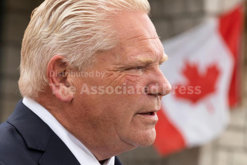 Ontario Premier Doug Ford speaks to media at a housing development in Hamilton, on Monday, Aug. 24, 2026. (Nick Iwanyshyn/The Canadian Press via AP)