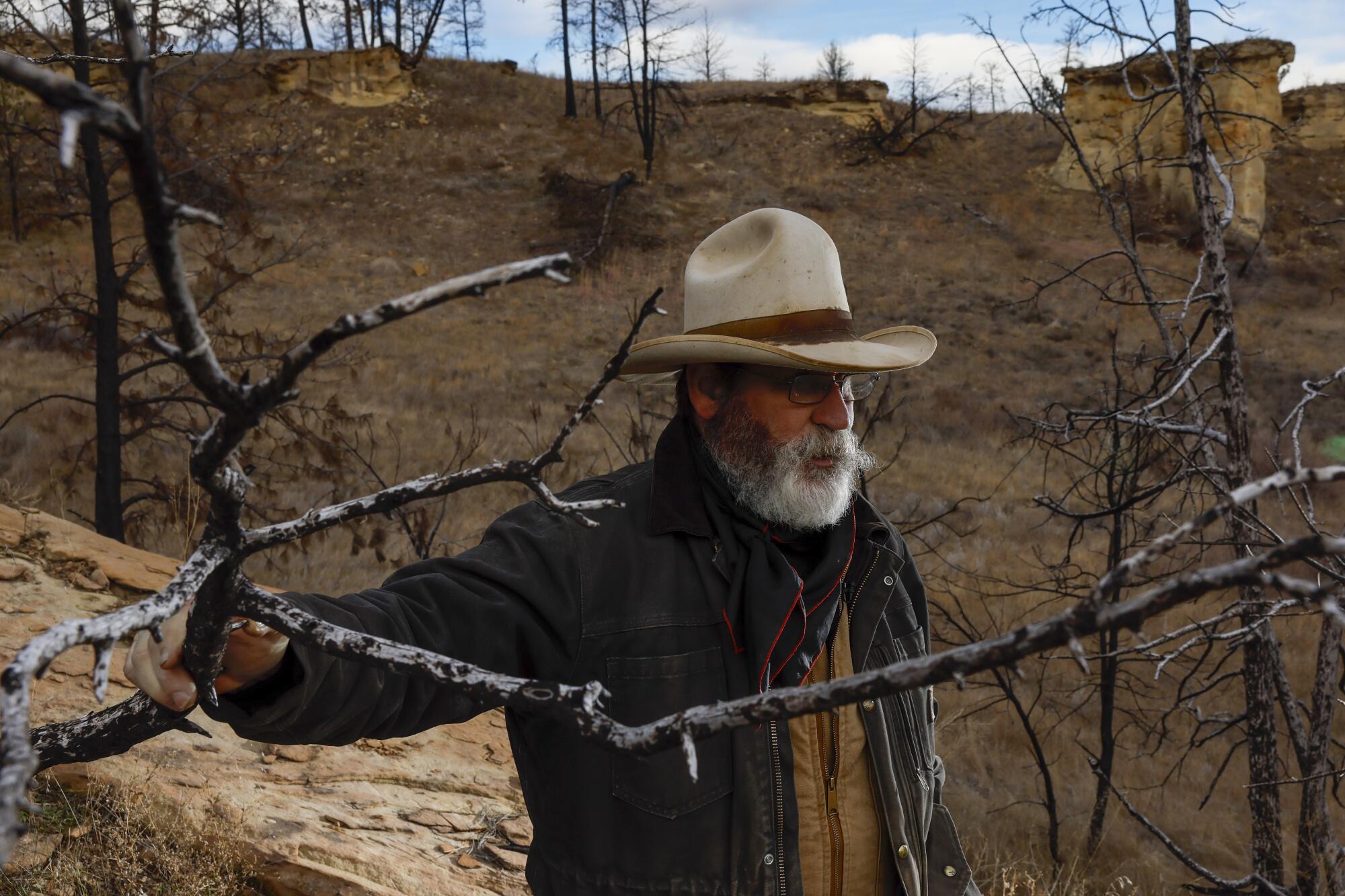 Rancher Clint McRae contemplates the environmental threats facing his family's land.