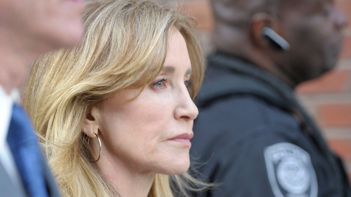 Felicity Huffman leaves court in Boston in April.