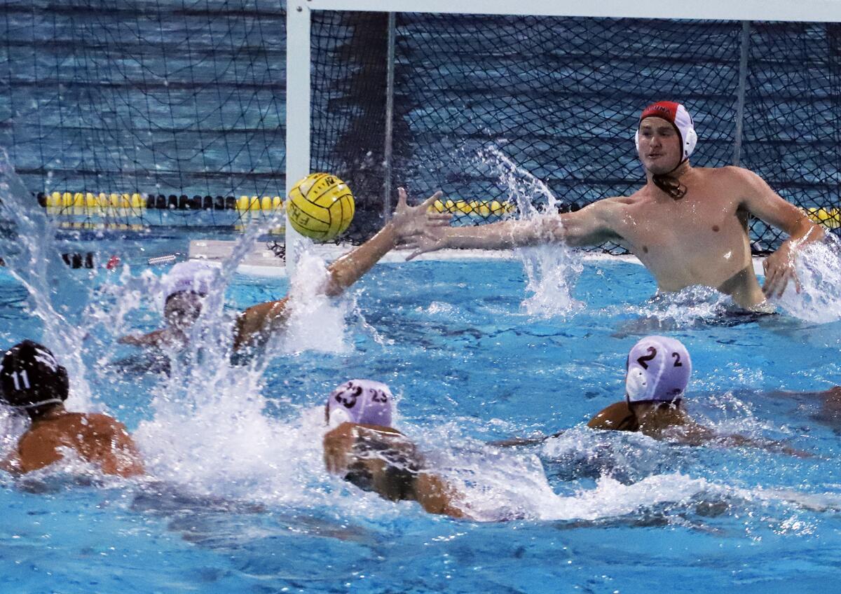 Laguna Beach goalkeeper Tyler Swenson (1) dives for the save against Foothill on Wednesday night.