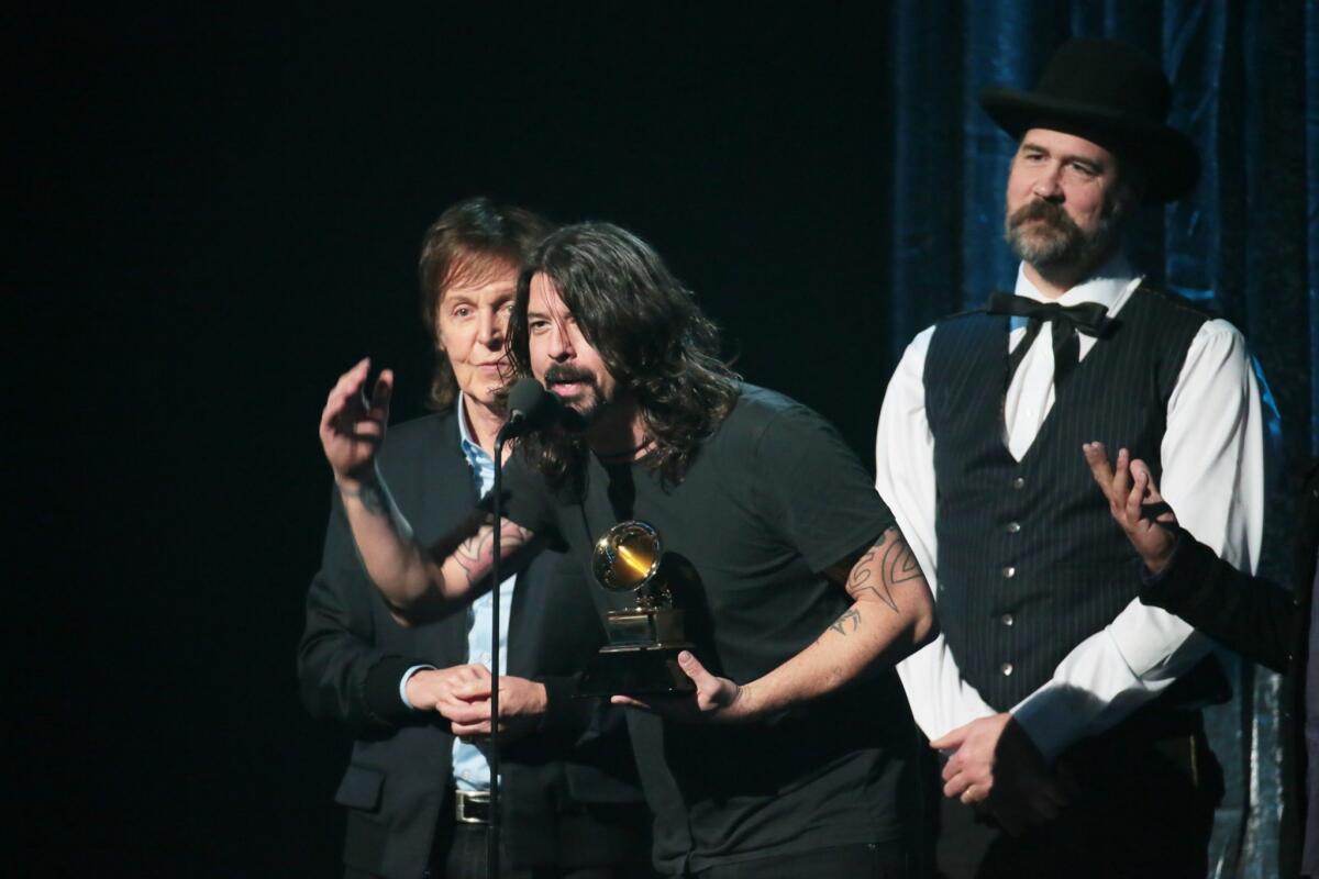 Paul McCartney, Dave Grohl and Krist Novoselic accept the Grammy for best rock song for "Cut Me Some Slack."