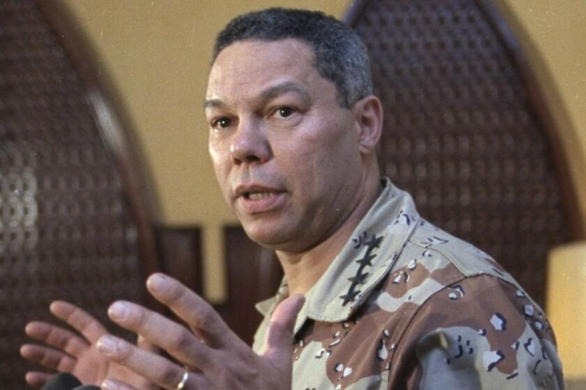 FILE - In this Sept. 14, 1990 file photo, Gen. Colin Powell, chairman of the Joint Chiefs of Staff, speaks to newsmen in Dhahran, Saudi Arabia, after visiting American troops who are deployed in the country. Colin Powell, former Joint Chiefs chairman and secretary of state, has died from COVID-19 complications, his family said Monday. (AP Photo/J. Scott Applewhite)