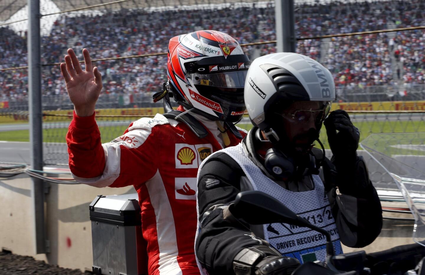 Ferrari Formula One driver Kimi Raikkonen of Finland waves after retiring from the race at the Mexican F1 Grand Prix at Autodromo Hermanos Rodriguez in Mexico City