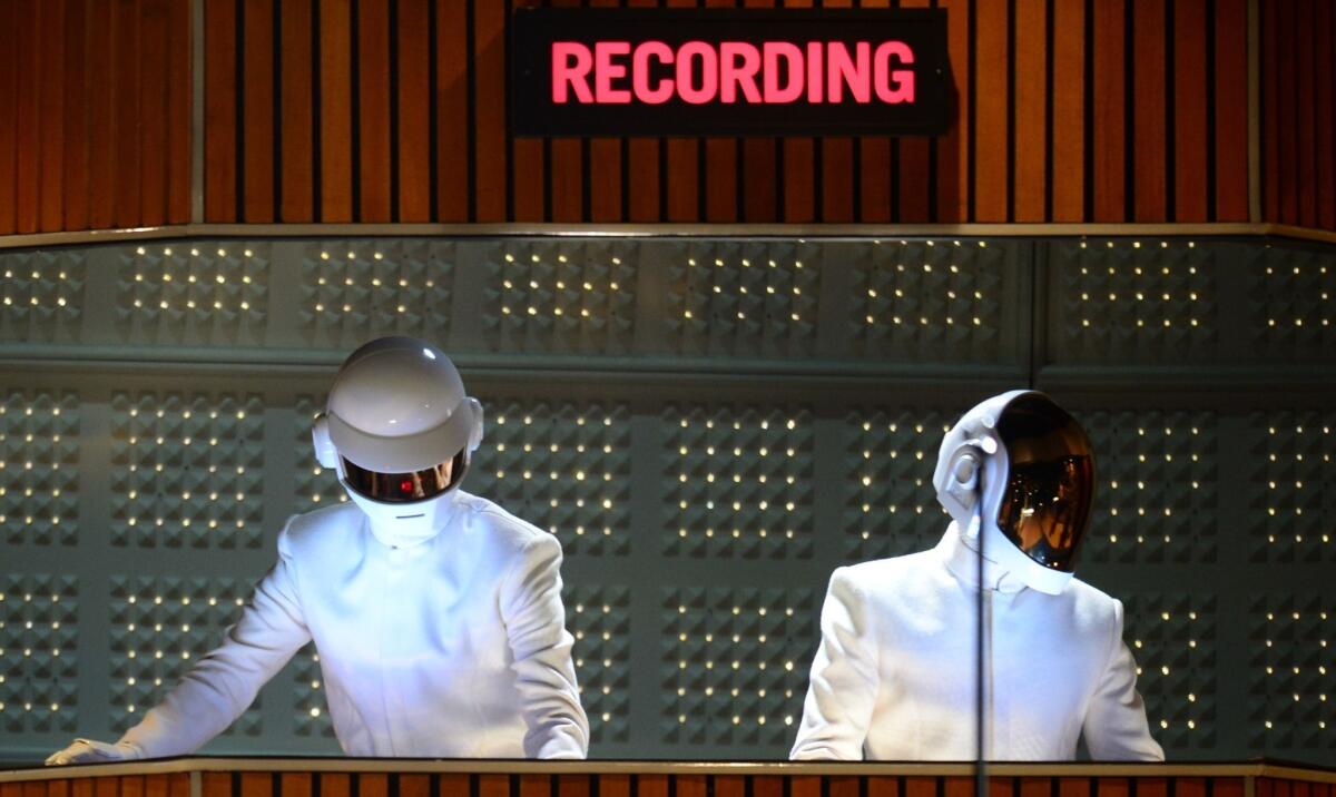 Grammy winners Daft Punk perform on stage for the 56th Grammy Awards at the Staples Center