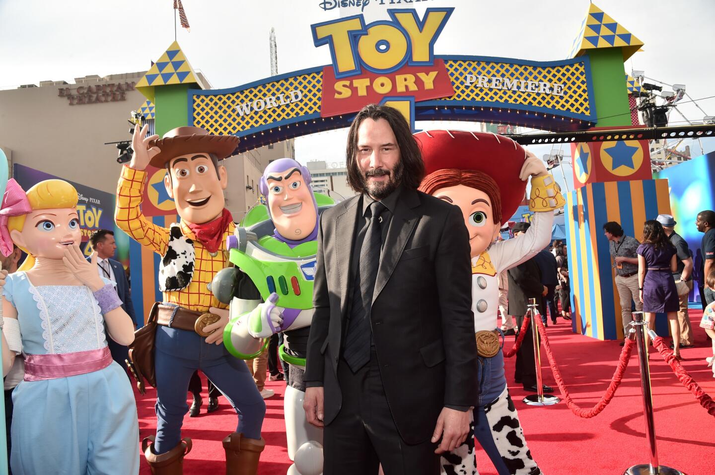 Keanu Reeves poses with characters at the world premiere of Disney and Pixar's "Toy Story 4" at the El Capitan Theatre in Hollywood, CA on Tuesday, June 11, 2019.