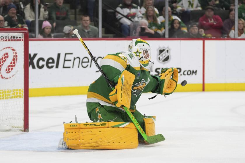 Minnesota Wild goaltender Marc-Andre Fleury reaches to stop a shot during the second period of an NHL hockey game against the Winnipeg Jets, Saturday, April 6, 2024, in St. Paul, Minn. (AP Photo/Abbie Parr)