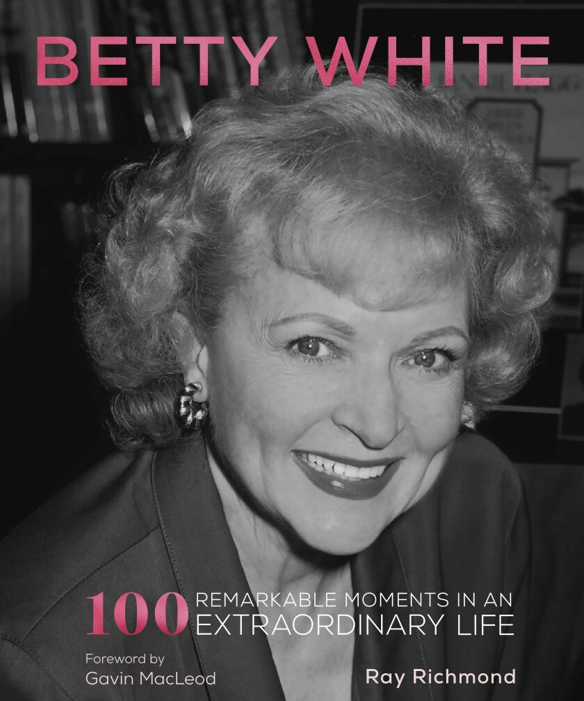 This cover image released by becker&mayer! shows "Betty White: 100 Remarkable Moments in an Extraordinary Life." (becker&mayer! via AP)