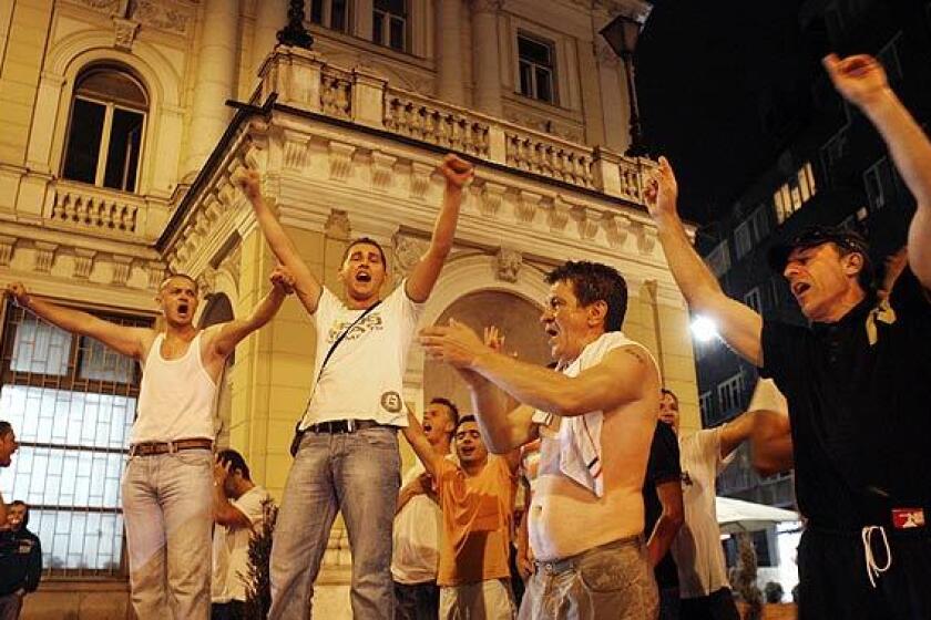 Residents of Sarajevo celebrate early today in the streets after hearing the news that Bosnian Serb wartime leader Radovan Karadzic was arrested in Belgrade. Karadzic and his military commander, Ratko Mladic, are seen as the main culprits of the Bosnian war in 1992 through 1995, which claimed an estimated 100,000 lives. The two men are indicted in connection with the Sarajevo siege during which up to 11,000 people were killed, and the Srebrenica genocide of 8,000 Muslim men and boys.