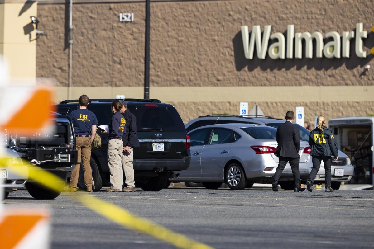 Law enforcement at the scene of the mass shooting at a Walmart in Chesapeake, Va.