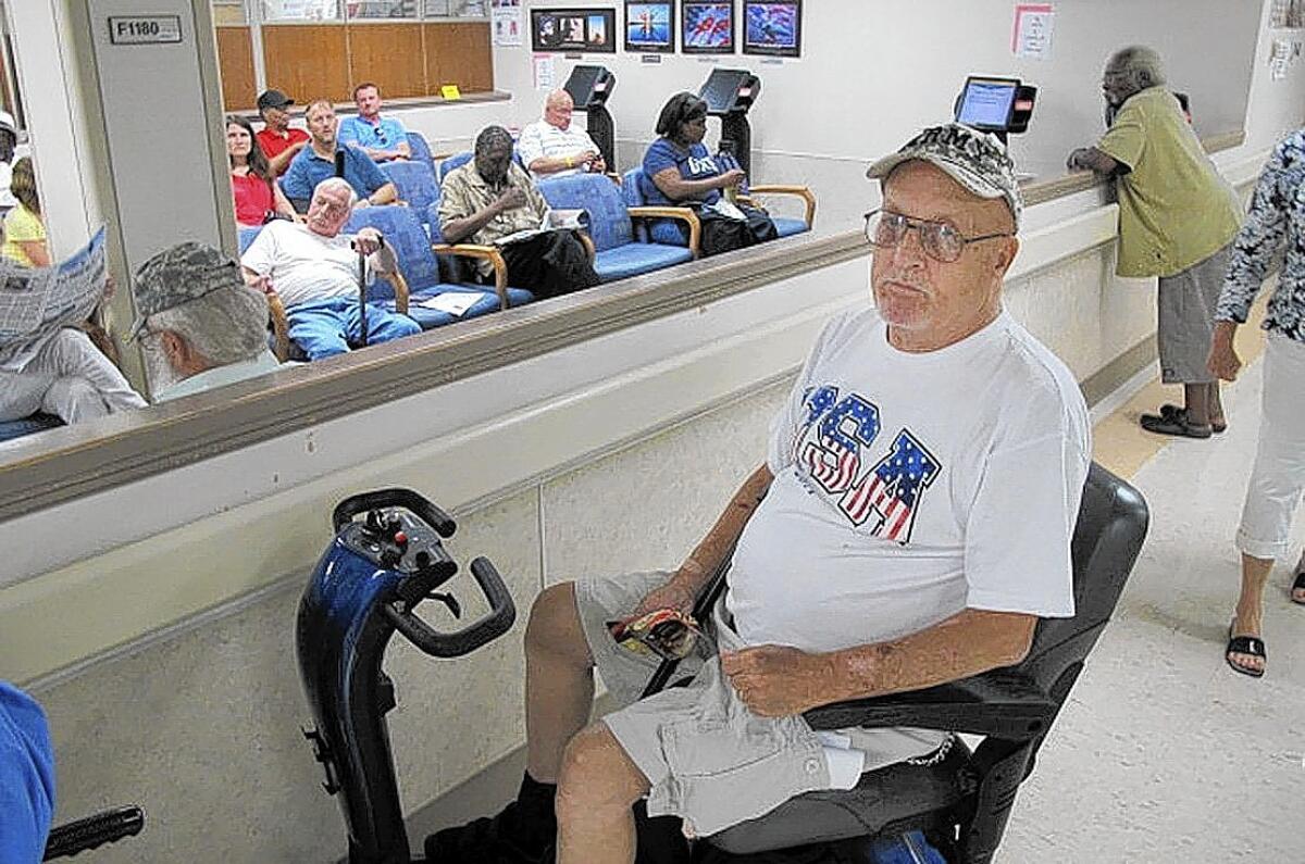 Dennis Hunter, 68, a Vietnam-era Army veteran, waited several months for an orthopedic appointment for knee and back injuries that require him to use a wheelchair.