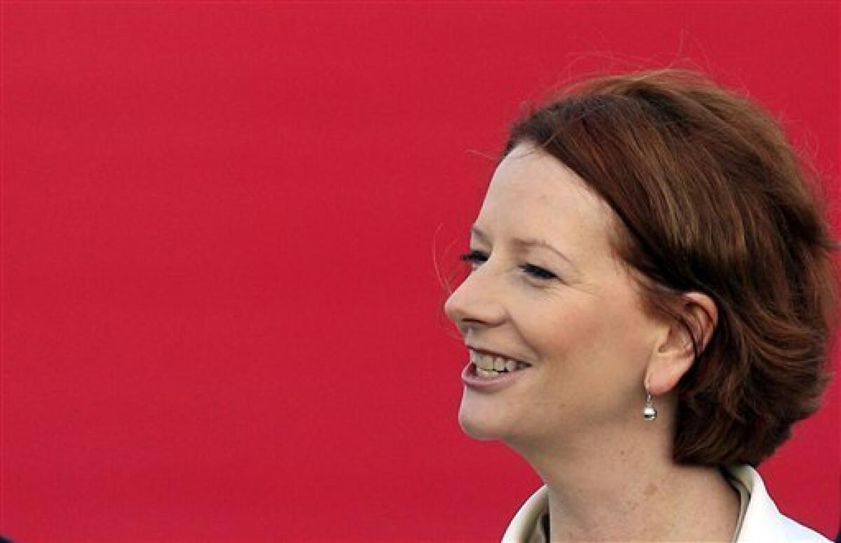 FILE - In this April 23, 2011 file photo, Australia's Prime Minister Julia Gillard reacts upon her arrival at Seoul military airport in Seongnam, south of Seoul, South Korea. Australian gay and lesbian couples will try to change Gillard's opposition to same-sex marriage when they dine at her official residence after activists won a charity auction to attend a private dinner party. Gillard had offered to host the dinner for any six guests at her official address in the national capital Canberra at an auction during the National Press Gallery's annual charity ball on Wednesday night, June 15, 2011. (AP Photo/Lee Jin-man, File)