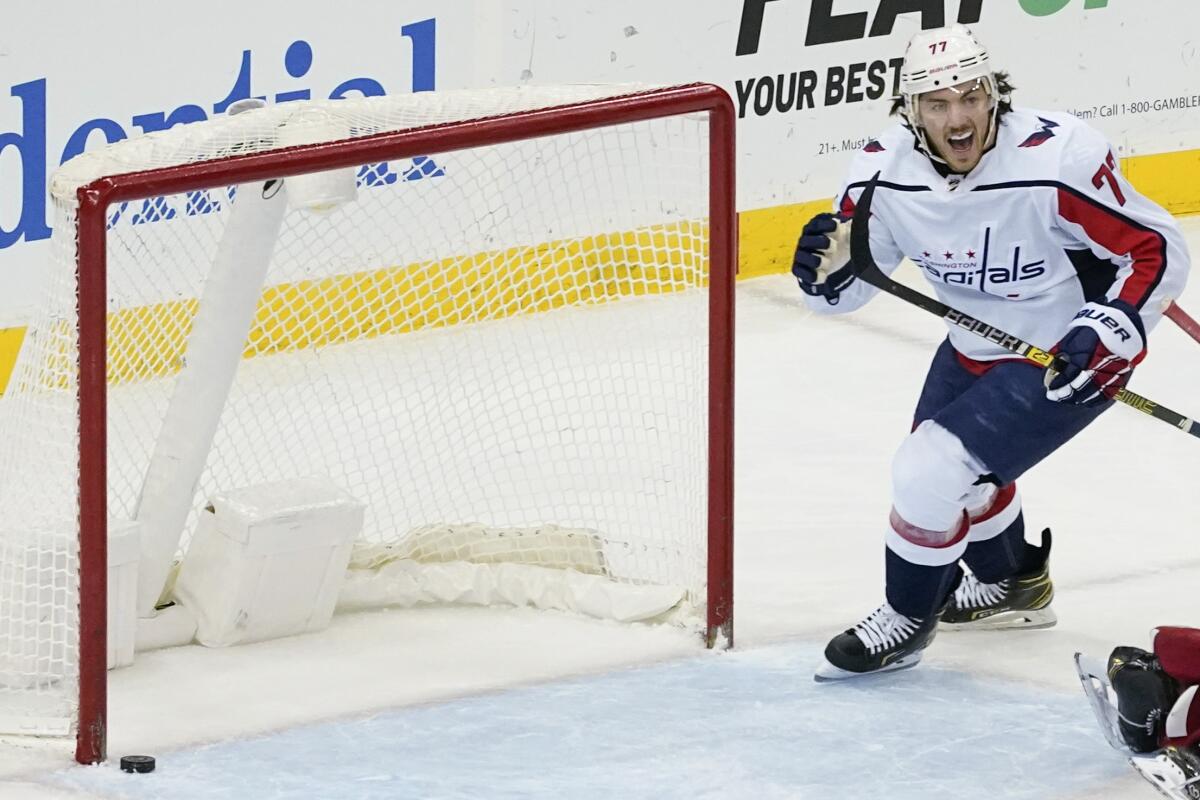 Washington Capitals right wing T.J. Oshie reacts after defenseman John Carlson scored during the second period of the team's NHL hockey game against the New Jersey Devils, Friday, April 2, 2021, in Newark, N.J. (AP Photo/Mary Altaffer)