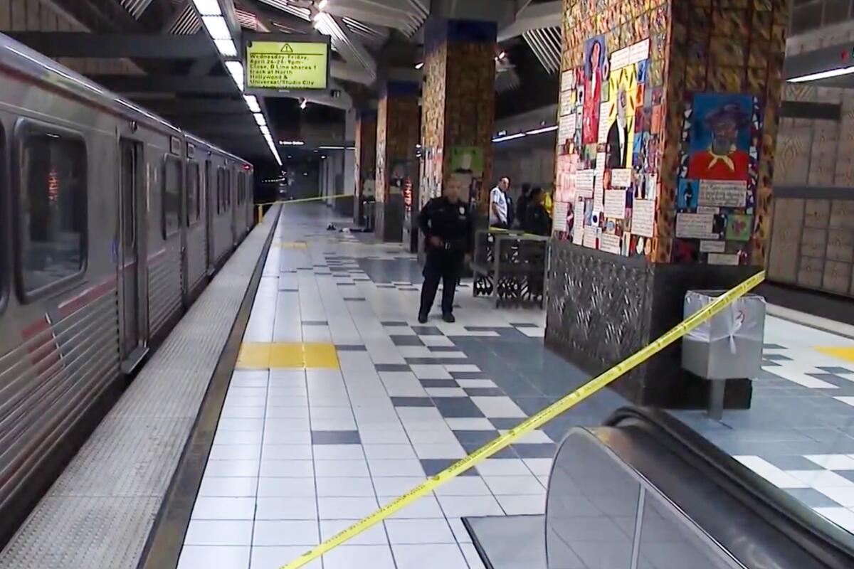 Police tape at a subway station.