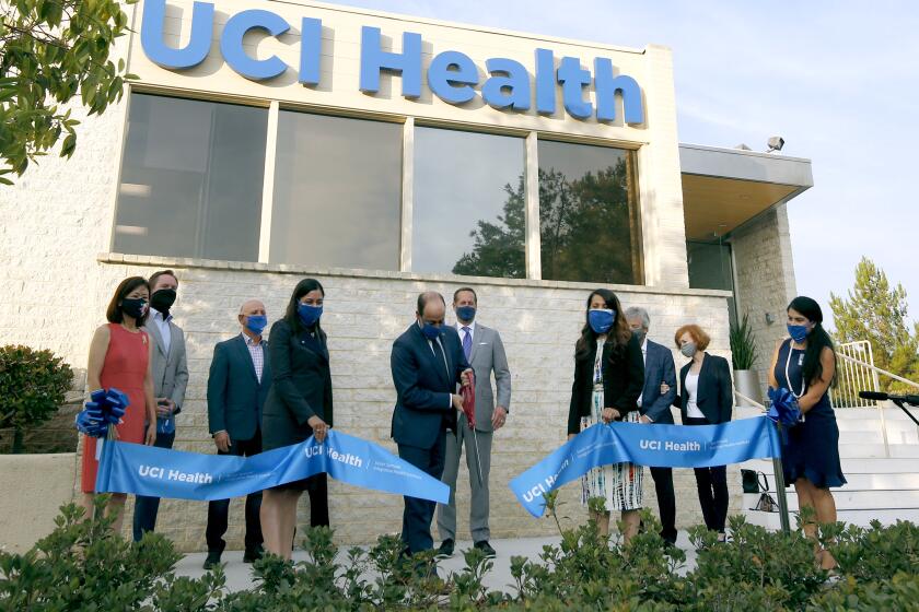 The UCI Health Newport Beach facility held a ribbon cutting at their new location in the Newport Center, in Newport Beach on Tuesday, Aug. 18, 2020. Chief executive officer at UCI Health Chad Lefteris cuts the ribbon.