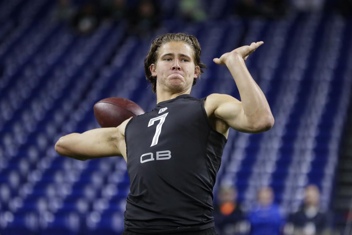Justin Herbert throws a pass during the NFL combine in Indianapolis.