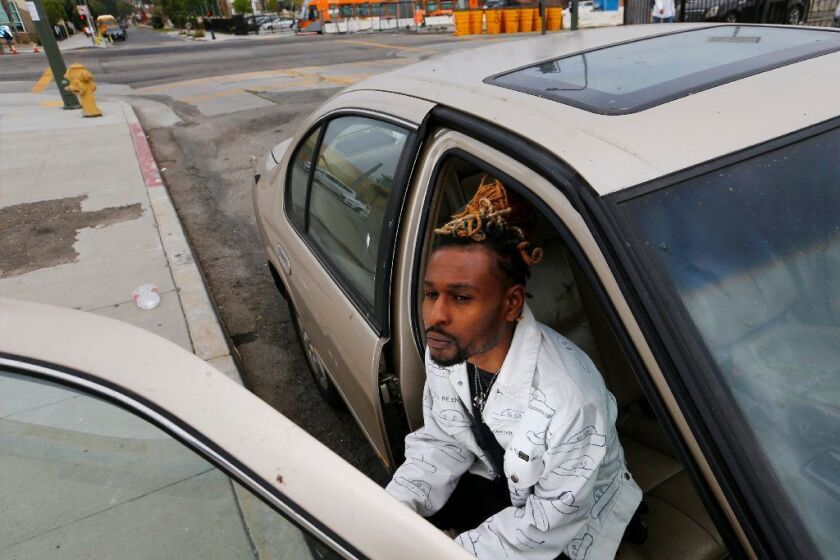 LOS ANGELES, CALIF. - MAY 2, 2019. Brian Allen is on the CalGang database though he is not a gang member. In 2017, he was driving with a friend when police pulled him over for expired tags. A year later, Allen received a letter informing him he'd been identified as a gang associate for being seen by police with this friend. He is still fighting to get off the database. (Luis Sinco/Los Angeles Times)