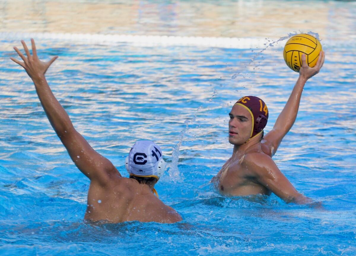 USC freshman Luka Brnetic, right, looks to shoot over Cal’s Roberto Valera on Sunday.