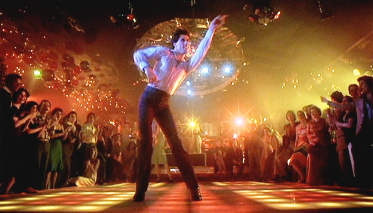 John Travolta discos on a light-up floor