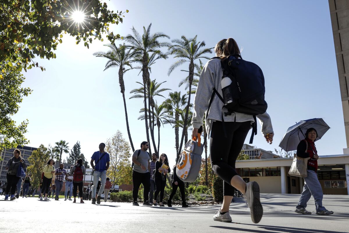 Students at Cal State Los Angeles. To eliminate tuition for all California residents would cost $4.3 billion, state budgeters estimate — $2.5 billion at UC and $1.8 billion at Cal State.