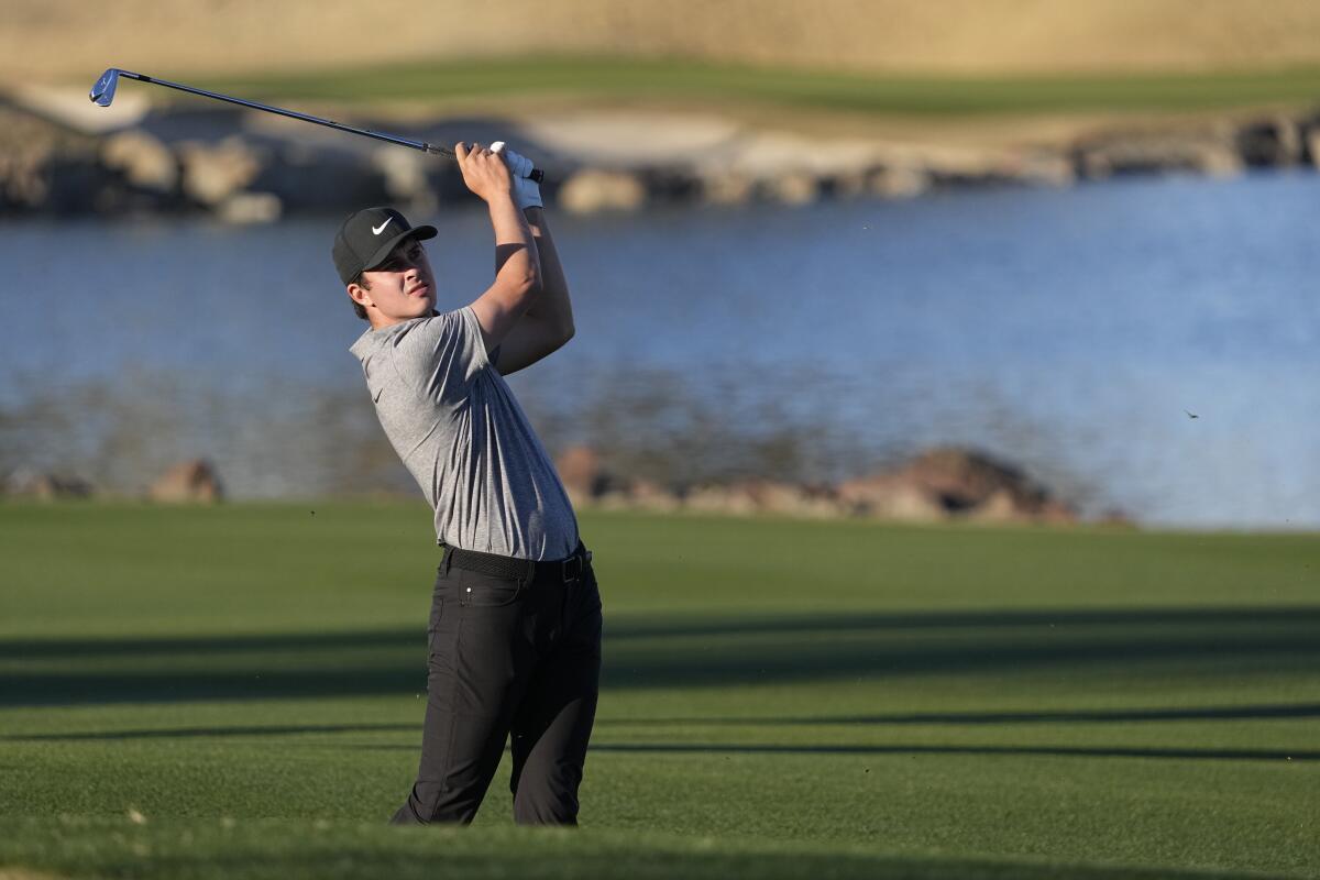 Davis Thompson hits from the fairway to the 18th hole during the American Express golf tournament Jan. 21, 2023.