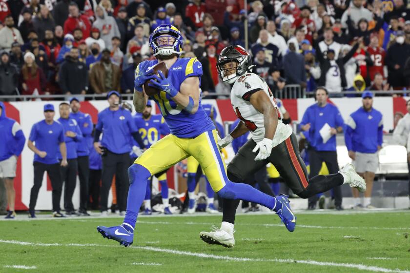 Rams wide receiver Cooper Kupp hauls in a catch against Tampa Bay Buccaneers safety Antoine Winfield Jr.