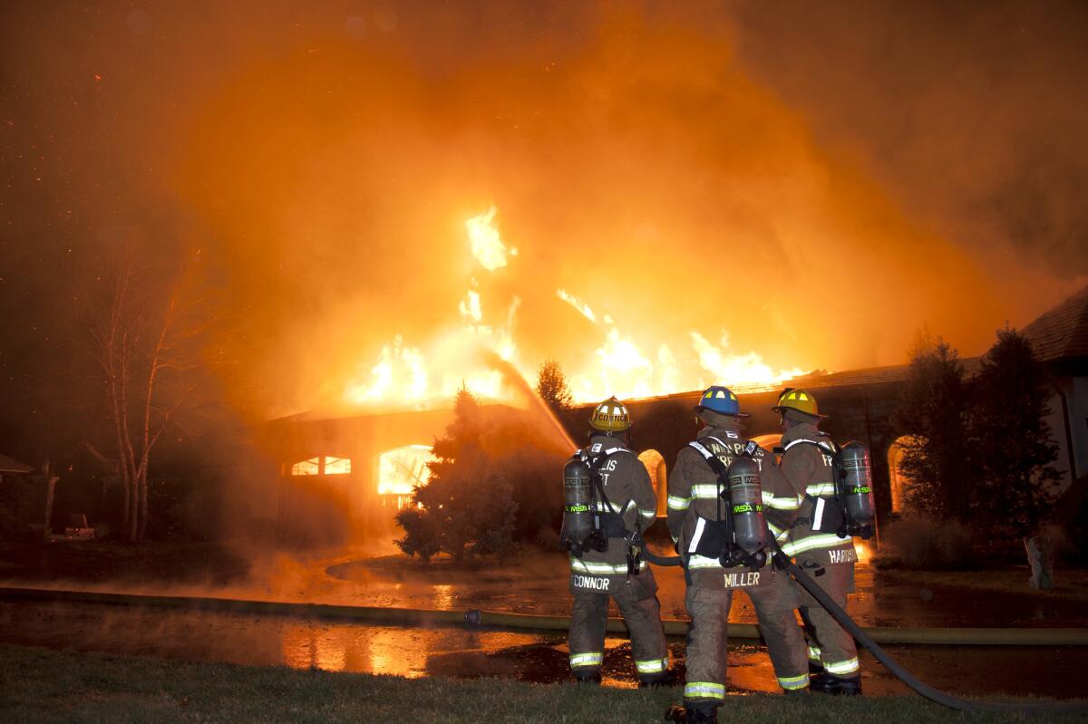 Firefighters battle a four-alarm fire at a mansion in Annapolis, Md., on Jan. 19.