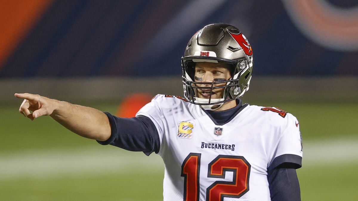 Buccaneers quarterback Tom Brady directs the offense during a game.