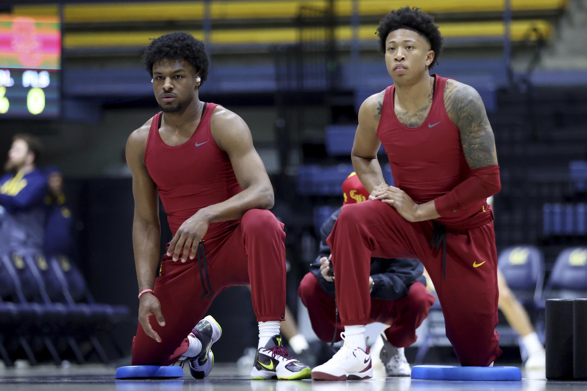 USC guards Boogie Ellis and Bronny James warm up before the team plays Cal on Feb. 7.