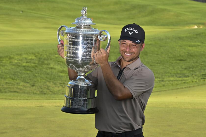 Xander Schauffele holds the Wanamaker trophy after winning the PGA Championship golf tournament at the Valhalla Golf Club, Sunday, May 19, 2024, in Louisville, Ky. (AP Photo/Jon Cherry)