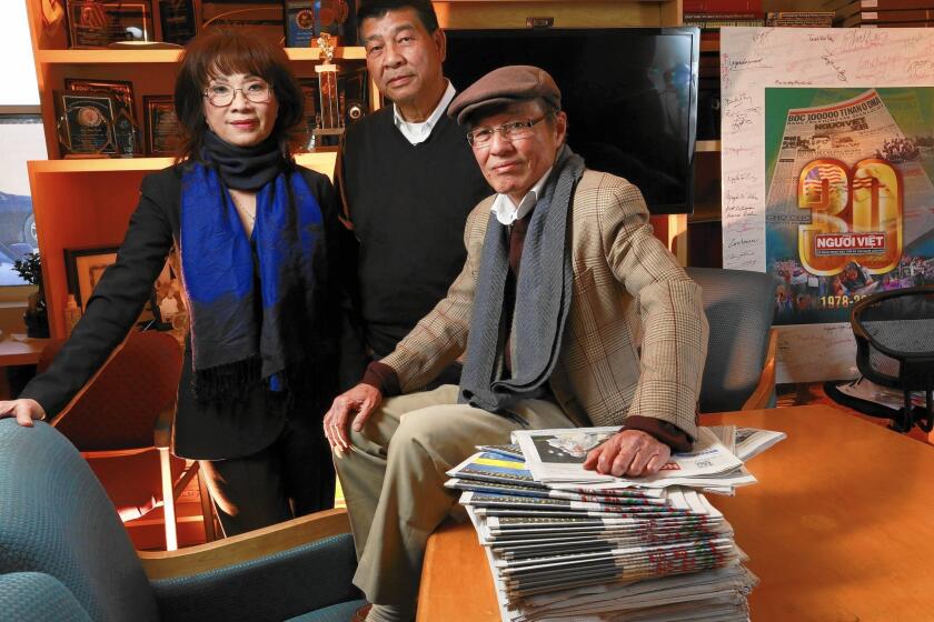 Vinh "Vicky" Hoang, left, Thai Dinh, center and Dat Phan of Nguoi Viet at the paper's offices in Westminster.