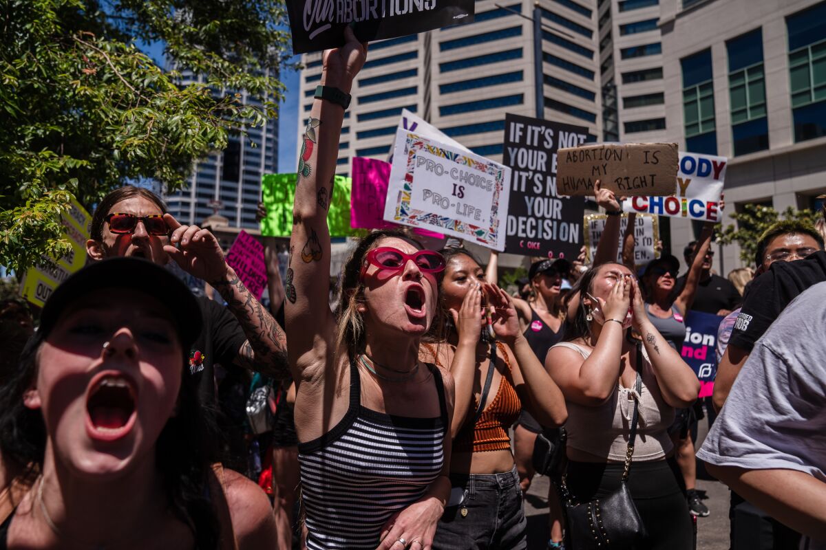 Marchers gather in downtown San Diego on Saturday calling for abortion rights.
