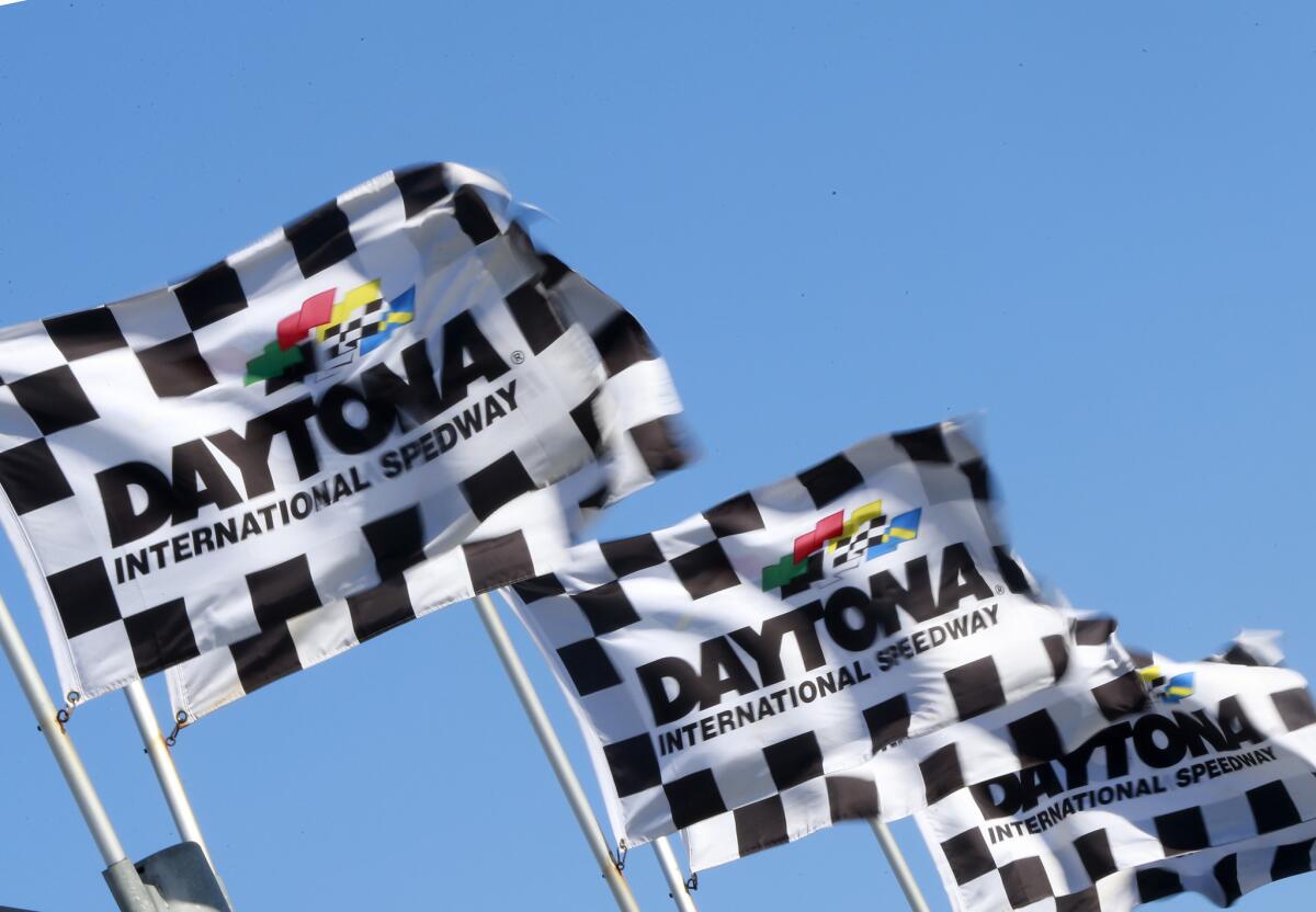 Daytona International Speedyway flags fly during practice for the NASCAR Sprint Cup Series Daytona 500 on Feb. 13.