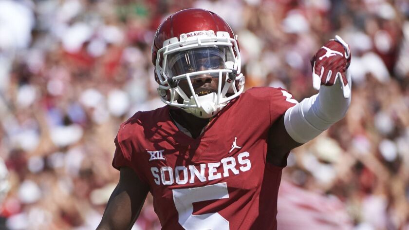Oklahoma wide receiver Marquise Brown gestures “horns down” as he celebrates a touchdown against Texas on Oct. 6, 2018.