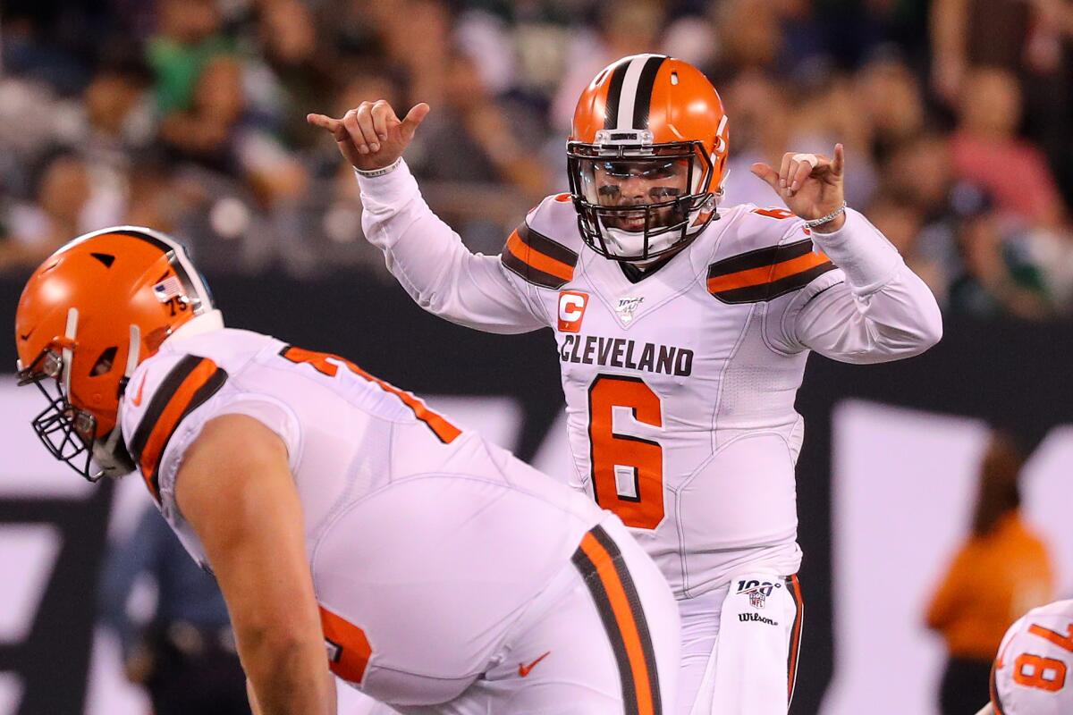 leveland Browns quarterback Baker Mayfield signals at the line.