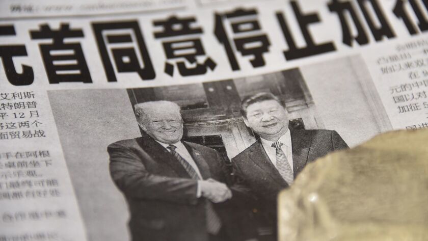 A newspaper headline in Beijing says President Trump and Chinese President Xi Jinping agreed not to increase tariffs, but complex negotiations lie ahead.