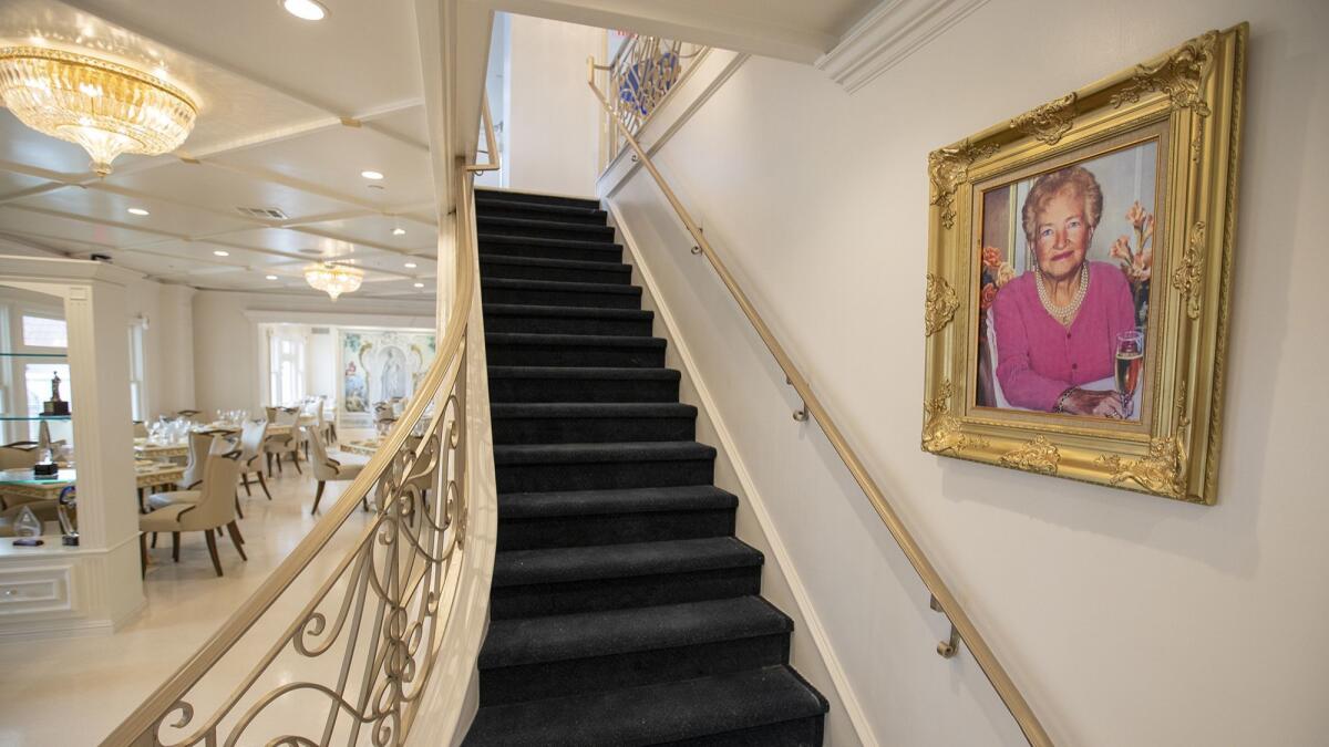 A portrait of Bruno Serato's mother, Caterina, hangs on the staircase wall in his Anaheim White House restaurant.
