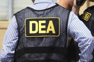 FILE - This June 13, 2016 file photo shows Drug Enforcement Administration (DEA) agents in Florida. On Friday, Feb. 21, 2020, the FBI arrested U.S. federal narcotics agent Jose Irizarry and his wife, Nathalia Gomez Irizarry, at their residence in Puerto Rico, according to a law enforcement official familiar with the arrest. He has been charged with conspiring to launder money with the very same Colombian drug cartels he was supposed to be fighting. (Joe Burbank/Orlando Sentinel via AP, File)