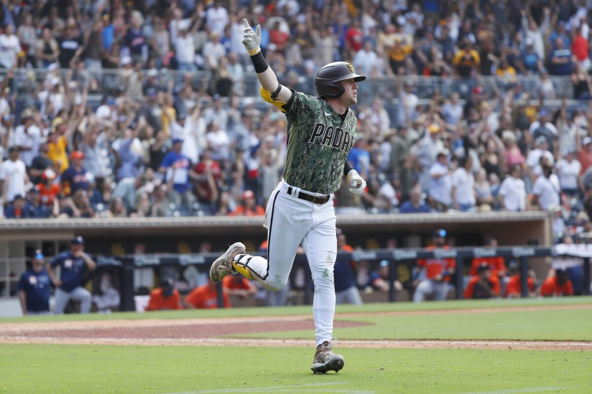 Padres' Jake Cronenworth celebrates a walk-off home run against the Houston Astros at Petco Park.